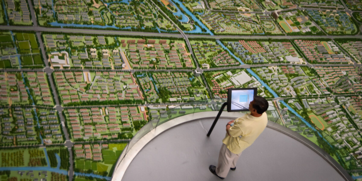 Man surveying residential area from above